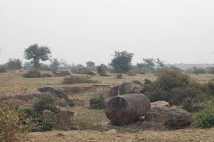 The incomplete sandstone boulders strewn around